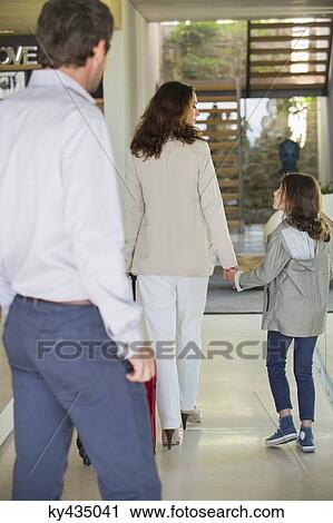 Man looking at his family leaving home View Large Photo Image Stock Image - Man looking at his family leaving home. Fotosearch
