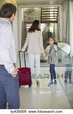 Man looking at his family leaving home View Large Photo Image Stock Photo - Man looking at his family leaving home. Fotosearch