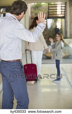 Man waving to his daughter leaving home View Large Photo Image Stock Image - Man waving to his daughter leaving home. Fotosearch