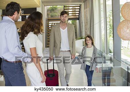 Man with his daughter arriving at his friends home from holiday View Large Photo Image Stock Image - Man with his daughter arriving at his friends home from holiday. Fotosearch