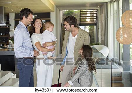 Man with his daughter arriving from holiday at his friends home View Large Photo Image Stock Image - Man with his daughter arriving from holiday at his friends home. Fotosearch