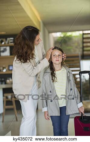 Woman welcoming her daughter arriving from holidays View Large Photo Image Stock Image - Woman welcoming her daughter arriving from holidays. Fotosearch