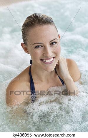 Portrait of a smiling beautiful woman in a hot tub View Large Photo Image Stock Photography - Portrait of a smiling beautiful woman in a hot tub. Fotosearch