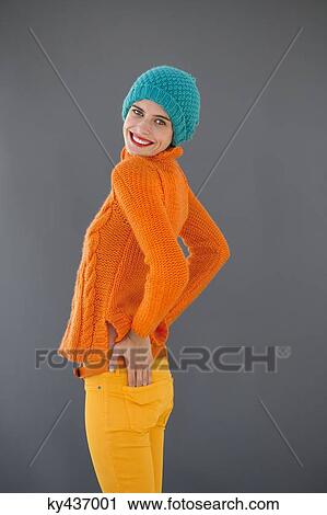 Stock Image - Portrait of a smiling woman posing. Fotosearch