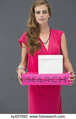Portrait of a woman holding boxes View Large Photo Image Stock Image - Portrait of a woman holding boxes. Fotosearch