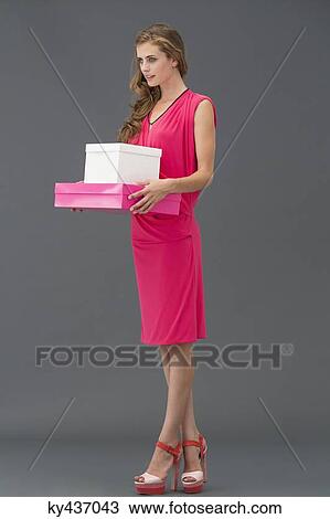Woman carrying boxes View Large Photo Image Stock Image - Woman carrying boxes. Fotosearch