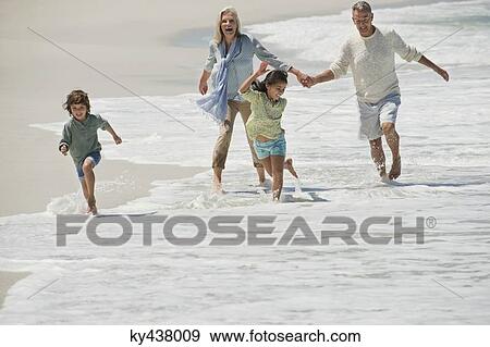 Children playing with their grandparents on the beach View Large Photo Image Stock Photo - Children playing with their grandparents on the beach. Fotosearch
