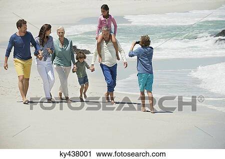 Family enjoying on the beach View Large Photo Image Stock Image - Family enjoying on the beach. Fotosearch