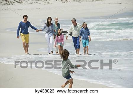 Family enjoying on the beach View Large Photo Image Stock Image - Family enjoying on the beach. Fotosearch