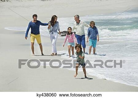 Family enjoying on the beach View Large Photo Image Stock Image - Family enjoying on the beach. Fotosearch