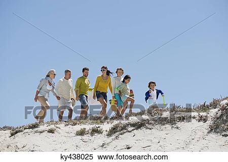 Family walking on the beach View Large Photo Image Stock Photography - Family walking on the beach. Fotosearch