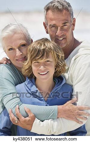 Portrait of a boy with his grandparents on the beach View Large Photo Image Stock Image - Portrait of a boy with his grandparents on the beach. Fotosearch