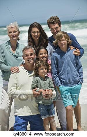 Portrait of a family smiling on the beach View Large Photo Image Picture - Portrait of a family smiling on the beach. Fotosearch