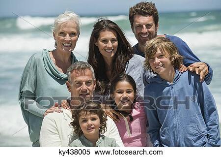 Portrait of a family smiling on the beach View Large Photo Image Stock Photography - Portrait of a family smiling on the beach. Fotosearch