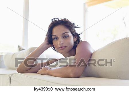 Portrait of a woman lying on the bed View Large Photo Image Stock Image - Portrait of a woman lying on the bed. Fotosearch