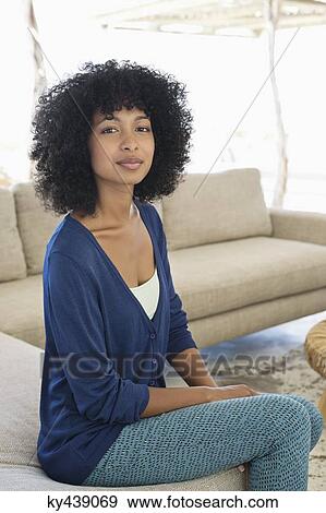 Portrait of a woman sitting View Large Photo Image Stock Photo - Portrait of a woman sitting. Fotosearch