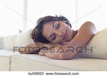 Woman relaxing on the bed View Large Photo Image Stock Image - Woman relaxing on the bed. Fotosearch
