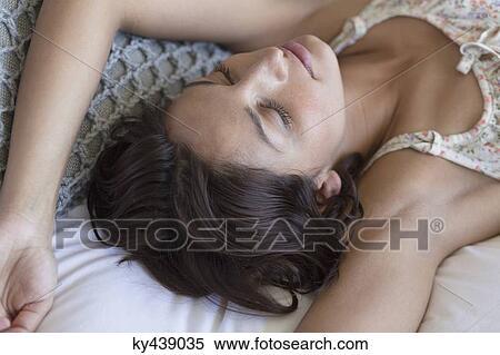 Woman sleeping on the bed View Large Photo Image Stock Photography - Woman sleeping on the bed. Fotosearch