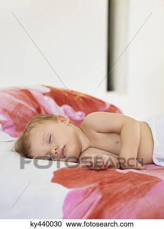 Baby boy sleeping in the bed View Large Photo Image Stock Image - Baby boy sleeping in the bed. Fotosearch