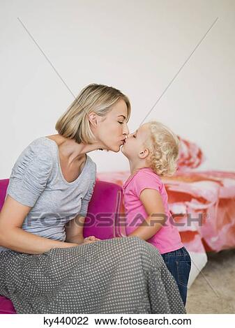 Mother and daughter kissing each other View Large Photo Image Stock Image - Mother and daughter kissing each other. Fotosearch