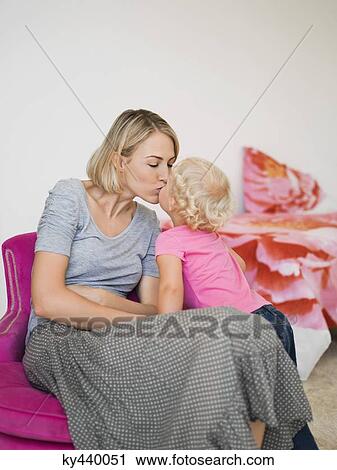 Mother and daughter kissing each other View Large Photo Image Stock Image - Mother and daughter kissing each other. Fotosearch