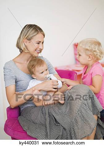 Smiling mother with her children View Large Photo Image Stock Image - Smiling mother with her children. Fotosearch