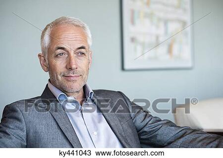Close-up of a businessman thinking View Large Photo Image Stock Image - Close-up of a businessman thinking. Fotosearch
