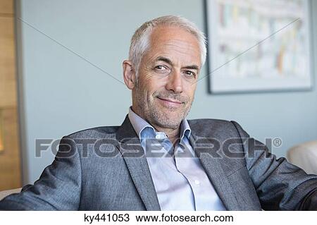 Portrait of a businessman smiling View Large Photo Image Stock Image - Portrait of a businessman smiling. Fotosearch