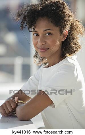 Portrait of a woman smiling View Large Photo Image Stock Photograph - Portrait of a woman smiling. Fotosearch