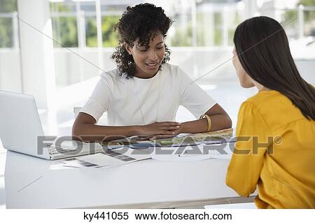 Real estate agent discussing with a woman View Large Photo Image Stock Photography - Real estate agent discussing with a woman. Fotosearch