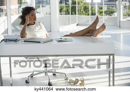 Woman sitting on a chair at home and thinking View Large Photo Image Picture - Woman sitting on a chair at home and thinking. Fotosearch