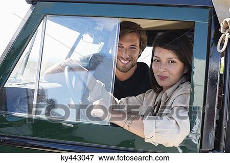 Couple in a SUV View Large Photo Image Stock Photo - Couple in a SUV. Fotosearch