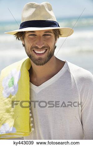Portrait of a man smiling on the beach View Large Photo Image Stock Photo - Portrait of a man smiling on the beach. Fotosearch