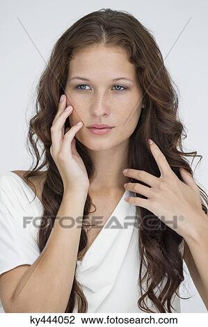 Close-up of a beautiful woman posing View Large Photo Image Stock Image - Close-up of a beautiful woman posing. Fotosearch