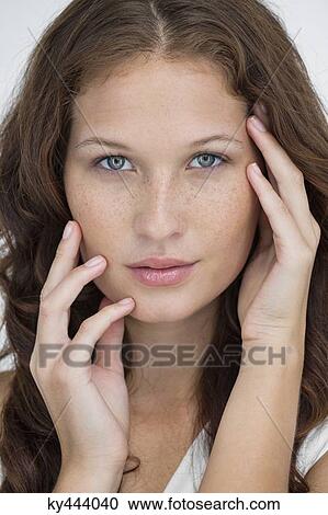 Stock Image - Portrait of a beautiful woman posing. Fotosearch