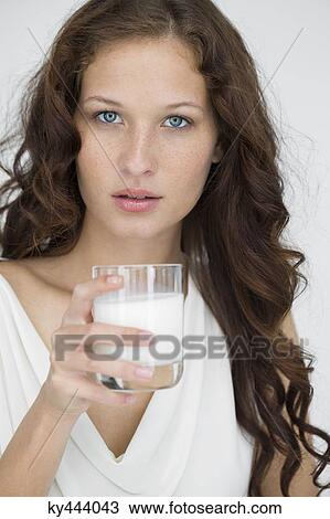 Portrait of a woman drinking milk View Large Photo Image Stock Image - Portrait of a woman drinking milk. Fotosearch