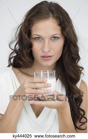 Portrait of a woman drinking milk View Large Photo Image Stock Photography - Portrait of a woman drinking milk. Fotosearch