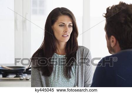 Stock Photography - Close-up of a couple discussing at home. Fotosearch
