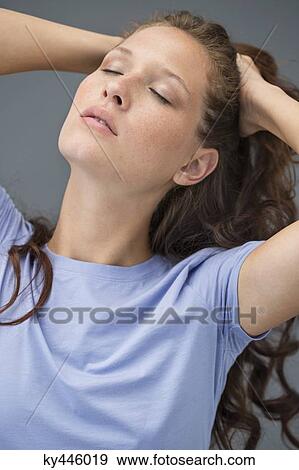 Close-up of a woman posing View Large Photo Image Stock Photo - Close-up of a woman posing. Fotosearch