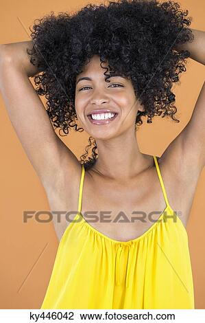 Portrait of a smiling woman posing View Large Photo Image Stock Image - Portrait of a smiling woman posing. Fotosearch