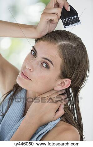 Portrait of a woman dyeing her hair View Large Photo Image Stock Image - Portrait of a woman dyeing her hair. Fotosearch