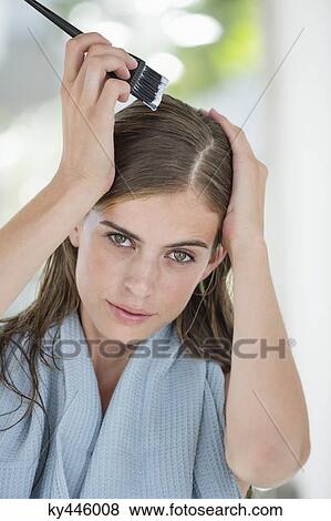 Portrait of a woman dyeing her hair View Large Photo Image Stock Photo - Portrait of a woman dyeing her hair. Fotosearch