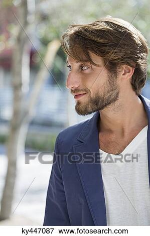 Stock Photo - Close-up of a man looking away. Fotosearch