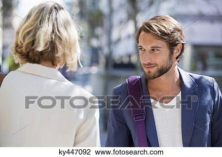 Man flirting a woman View Large Photo Image Stock Image - Man flirting a woman. Fotosearch