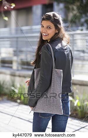 Portrait of a woman smiling View Large Photo Image Stock Photo - Portrait of a woman smiling. Fotosearch