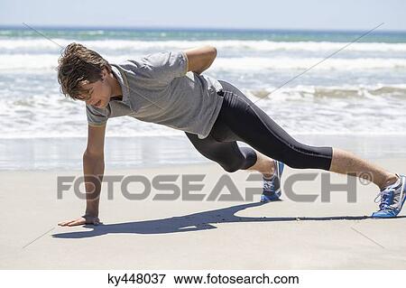 Man exercising on the beach View Large Photo Image Stock Photo - Man exercising on the beach. Fotosearch