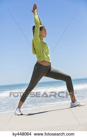 Woman exercising on the beach View Large Photo Image Picture - Woman exercising on the beach. Fotosearch