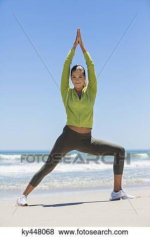 Woman exercising on the beach View Large Photo Image Stock Photo - Woman exercising on the beach. Fotosearch
