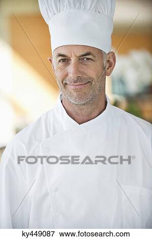 Portrait of a chef smiling View Large Photo Image Stock Photo - Portrait of a chef smiling. Fotosearch