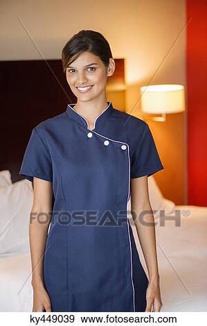 Portrait of a maid smiling in a hotel room View Large Photo Image Stock Photo - Portrait of a maid smiling in a hotel room. Fotosearch